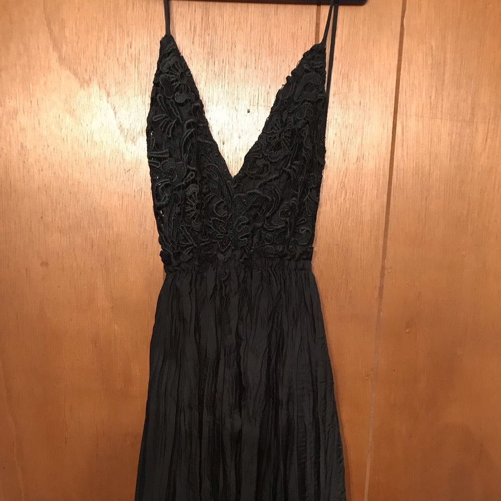 Low back. Black mini dress.